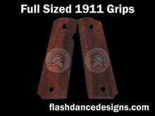 Load image into Gallery viewer, Full sized 1911 grips in cocobolo, stippled background with a spartan helm