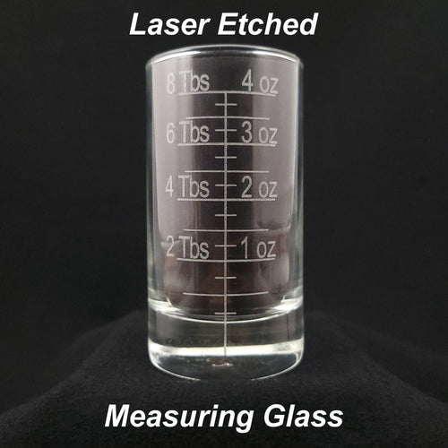 Laser etched measuring glass featuring eight (8) tablespoon (Tbs) and four (4) ounce (oz) measurements in one convenient, durable solution
