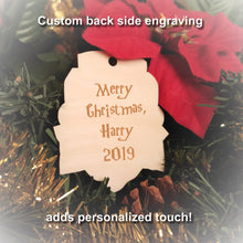 Load image into Gallery viewer, Laser engraved birch Christmas ornament with the Harry Potter Hogwarts House crest of Gryffindor. Add custom engraved text to the back for a personalized touch.