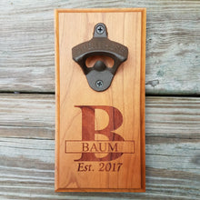 Load image into Gallery viewer, Hardwood bottle opener measuring 4" x 8", laser engraved with a custom monogram and year. The bottle opener includes a rare earth magnet to hold bottle caps.