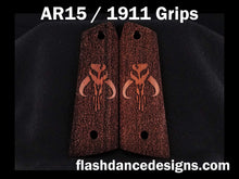 Load image into Gallery viewer, Walnut AR 1911 grips laser engraved with a popular bounty hunter logo over a stippled background

