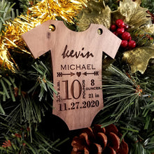 Load image into Gallery viewer, Commemorate the new baby in your life with this darling holiday ornament. This one of a kind item makes a perfect gift any time of year.  Customized with the baby&#39;s first &amp; middle name, birth weight &amp; length, and date &amp; time of birth. Available in maple, walnut or cherry woods. 
