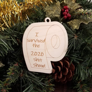 Celebrate the close of 2020 with this memorial birch ornament in the shape of a roll of toilet paper engraved with the text "I survived the 2020 sh*t show"