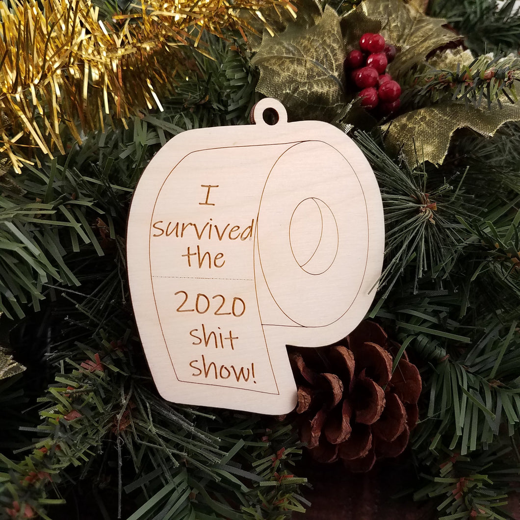 Celebrate the close of 2020 with this memorial birch ornament in the shape of a roll of toilet paper engraved with the text 