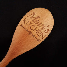 Load image into Gallery viewer, Customizable beech wood spoon laser engraved with Mom&#39;s Kitchen and a heart and arrow design
