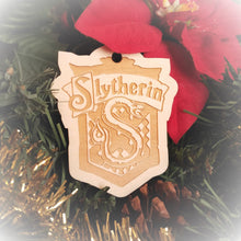Load image into Gallery viewer, Laser engraved birch Christmas ornament with the Harry Potter Hogwarts House crest of Slytherin.
