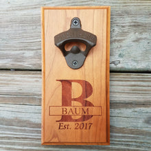 Load image into Gallery viewer, Hardwood bottle opener measuring 4&quot; x 8&quot;, laser engraved with a custom monogram and year. The bottle opener includes a rare earth magnet to hold bottle caps.
