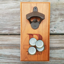 Load image into Gallery viewer, Hardwood bottle opener measuring 4&quot; x 8&quot;, laser engraved with a custom monogram and year. The bottle opener includes a rare earth magnet to hold bottle caps.
